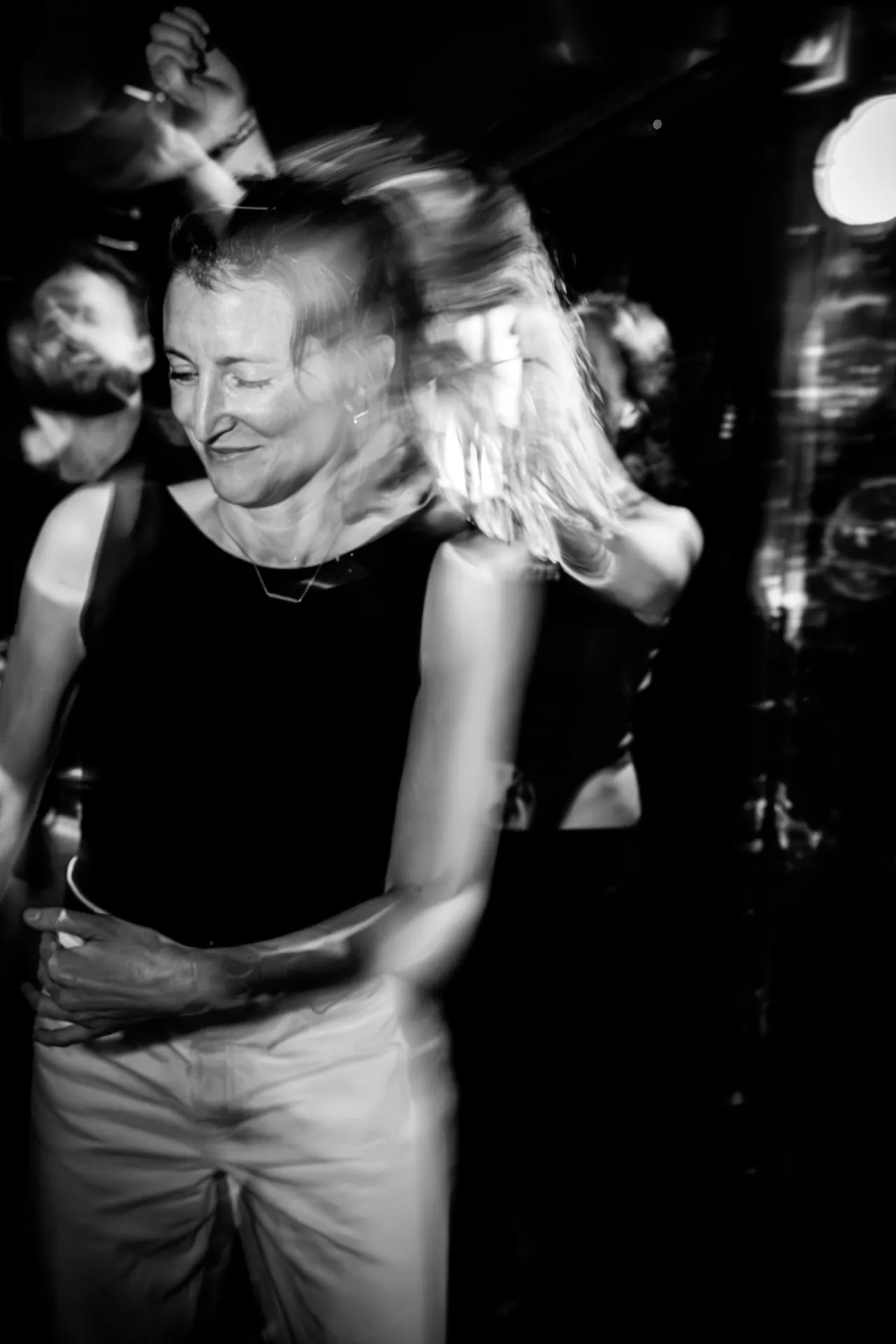 party schene in black and white, woman dancing